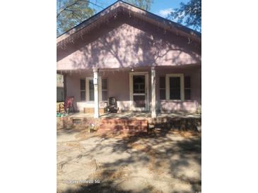 Charming single-Gathering home with a covered front porch, offering a welcoming entrance and curb appeal at 1820 S 9Th Ave., Conway, SC 29526