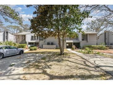 Charming townhouse with a mature tree in the front yard and private parking at 276 Salt Marsh Circle # 4D, Pawleys Island, SC 29585