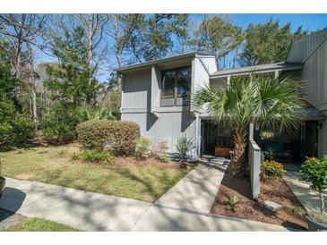 Charming two-story home with landscaped yard and inviting entryway at 358 Salt Marsh Circle # 10-A, Pawleys Island, SC 29585
