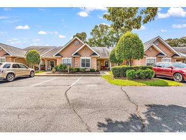 Charming single-story condo with well-maintained landscaping and convenient parking at 4652 Lightkeepers Way # 38-C, Little River, SC 29566