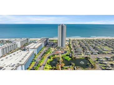 Stunning aerial view of oceanfront resort with modern high-rise and beautiful landscaping at 5905 South Kings Hwy. # 1708, Myrtle Beach, SC 29575