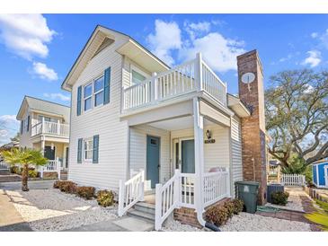Charming two-story beach home with a second story balcony and nicely landscaped front yard at 600-B 43Rd Ave. S, North Myrtle Beach, SC 29582