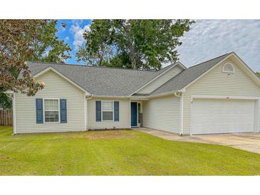 Charming single story home with manicured lawn, vinyl siding and a two car garage at 445 Saint Charles Circle, Myrtle Beach, SC 29588