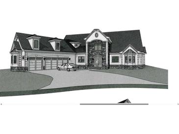 Stunning two-story home featuring a three-car garage, stone accents, and a well-manicured lawn at 2417 Gist Ln., Myrtle Beach, SC 29588