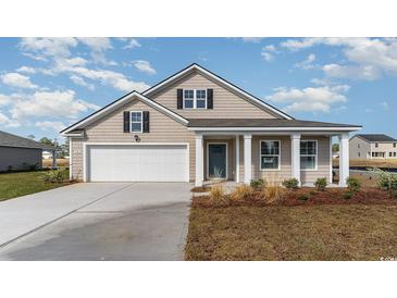 Charming single-story home featuring a manicured lawn, attached garage, and covered porch at 4480 East Coast Ln., Shallotte, NC 28470