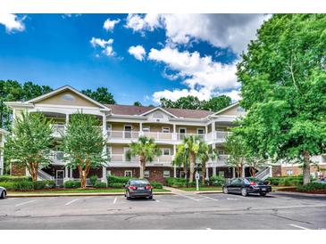Inviting condo complex features a multi-story building with ample parking at 5825 Catalina Dr. # 1133, North Myrtle Beach, SC 29582