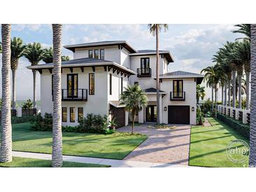 A stunning multi-story white home featuring a driveway, lush landscaping, and dark trim accents at 918 Strand Ave., North Myrtle Beach, SC 29582