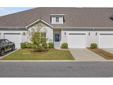 Charming home exterior with well-manicured lawn and inviting front entrance at 154 Sea Shell Dr. # 16, Murrells Inlet, SC 29576