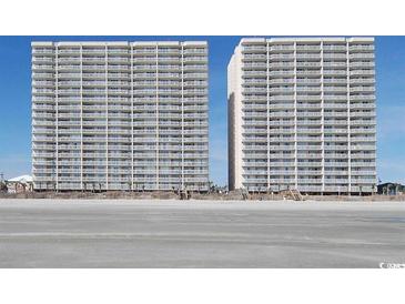Two towers of luxury beachfront condos rise above a sandy beach with a clear blue sky at 1625 S Ocean Blvd. # 1510, North Myrtle Beach, SC 29582