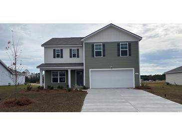 Charming two-story home with a two-car garage, neutral siding, and well-manicured lawn at 414 Acosta Circle, Conway, SC 29527
