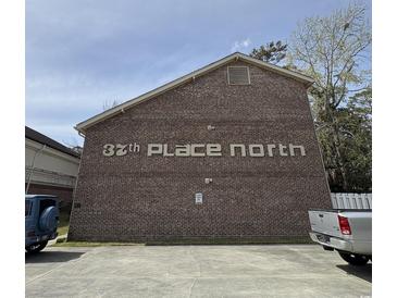 Apartment building exterior showing brick facade and signage, 37th Place North, parking available at 515 37Th Ave. N # 101, Myrtle Beach, SC 29572