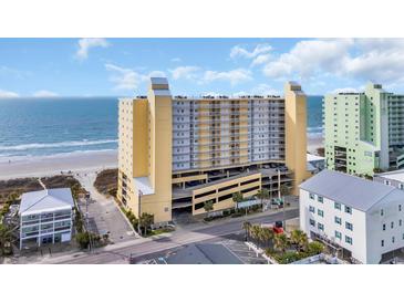 Beautiful beachfront condo building with multi-level parking and ocean views at 5404 N Ocean Blvd. N # 6-E, North Myrtle Beach, SC 29582