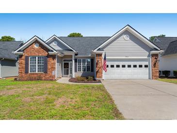 Charming single-story home featuring a brick facade, inviting entrance, and attached two-car garage at 542 Sand Ridge Rd., Conway, SC 29526