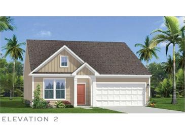 Charming single Gathering home with attached garage, landscaped yard, and tropical palm trees at 415 Joseph St, Longs, SC 29568
