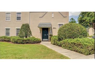 Charming two-story home with manicured landscaping and welcoming front entrance at 4603 Arran Ct. # C, Myrtle Beach, SC 29579
