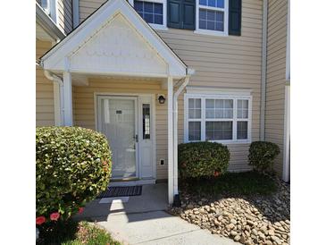 Inviting front entrance featuring well-maintained landscaping, a white door and trim for a clean, welcoming curb appeal at 703 S 1St Ave. S # 34D, North Myrtle Beach, SC 29582