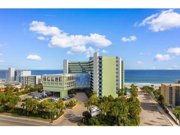 Stunning exterior view of hotel, beach and ocean at 1105 Coral Beach Circle # 438, Myrtle Beach, SC 29577