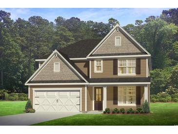 Charming two-story home with a landscaped yard, two-car garage, and wood-and-stone design accents at 338 Glacier Way, Conway, SC 29526