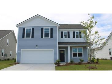 Charming two-story home featuring a two-car garage and well-maintained lawn at 5179 Yellowstone Dr., Conway, SC 29526