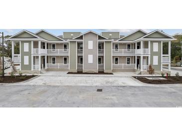 Beautiful townhome exterior featuring neutral colors, balconies, and well-maintained landscaping at 627 Bonaventure Dr. # 204, Myrtle Beach, SC 29577