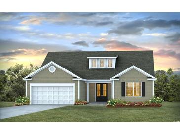 Charming single-story home with a two-car garage, neutral siding and a neatly manicured front lawn at 8956 Chesterfield Dr., Calabash, NC 28467