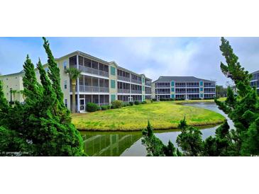 Beautiful condo community with pond, well-maintained landscaping, and inviting balconies at 1100 Commons Blvd. # 606, Myrtle Beach, SC 29572