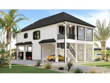 Stunning raised beach home with a modern design and lush landscaping at 196 Brown Pelican Loop, Pawleys Island, SC 29585