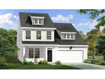 Charming two-story home with a dark roof, white siding and trim, and a well-maintained front yard at 451 Joseph St, Longs, SC 29568