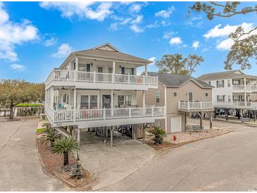 Beautiful coastal home with spacious decks, great for entertaining, on a sunny day near the water at 6001- 310 S Kings Hwy., Myrtle Beach, SC 29575