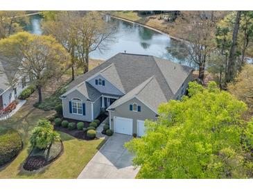 Beautiful single-Gathering home with a well-manicured lawn and situated on a picturesque waterfront property at 742 Camden Circle, Pawleys Island, SC 29585