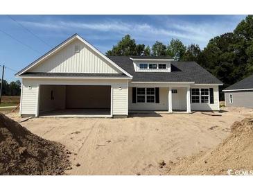 New construction home with a 2-car garage, gray roof, and white siding at 1395 Knotty Branch Rd., Conway, SC 29527