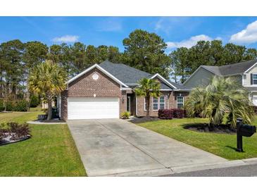 Charming brick home with attached garage, well-maintained lawn, and palm tree landscaping at 152 Shenandoah Dr., Murrells Inlet, SC 29576