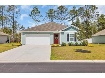 Charming single-story home with a manicured lawn, concrete driveway, and a vibrant red front door at 156 Teddy Bear Circle, Conway, SC 29526