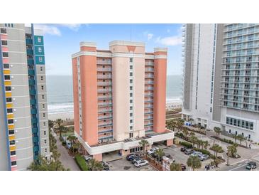 Stunning exterior shot of a beachfront condo building with multiple balconies and ocean views at 1604 N Ocean Blvd. # 904, Myrtle Beach, SC 29577