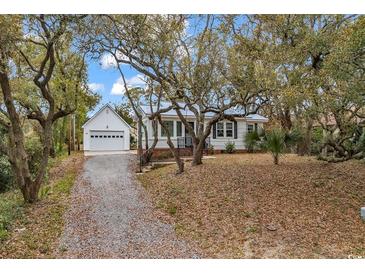 Charming home featuring a detached garage and mature trees at 313 73Rd Ave. N, Myrtle Beach, SC 29572