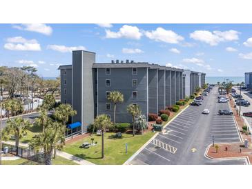 Beautiful condo complex showcasing multiple levels, manicured landscaping, ample parking, and convenient beach access at 5905 South Kings Hwy. # 132-A, Myrtle Beach, SC 29575