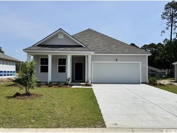 Charming single-story home with a two-car garage, well-manicured lawn, and inviting front porch at 643 Culmen Ct., Myrtle Beach, SC 29588