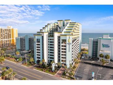 Beautiful exterior of Monterey Bay Suites featuring a parking area, street view, and nearby beach access at 6804 N Ocean Blvd. # 1127, Myrtle Beach, SC 29572