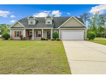 Charming single Gathering home with a well-maintained front yard, long driveway and 2-car garage at 270 Moulton Dr., Longs, SC 29568