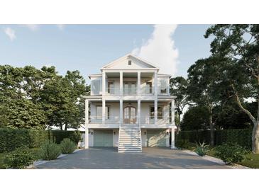 Stately three-story home with multiple balconies, grand columns, and a two-car garage at 914 Perrin Dr., North Myrtle Beach, SC 29582