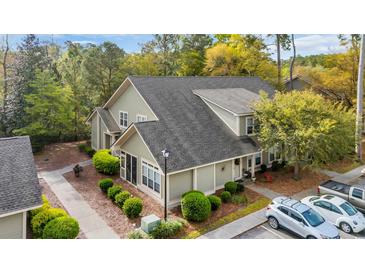 Charming townhouse featuring manicured landscaping and neutral color palette at 1545 Spinnaker Dr. # 2C, North Myrtle Beach, SC 29582