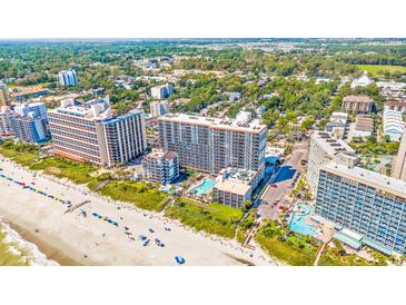 Expansive aerial view of beachfront resort property and coastline with pools and amenities at 7200 N Ocean Blvd. # 1053, Myrtle Beach, SC 29572