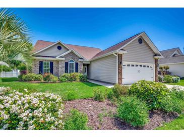 Charming single-Gathering home with a well-manicured lawn and mature landscaping at 109 Pheasant Run Dr., Murrells Inlet, SC 29576