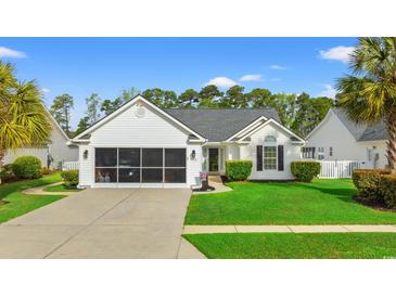 Charming single-story home with a screened garage and a well-maintained front lawn at 176 Somerworth Circle, Surfside Beach, SC 29575