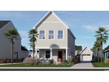 Charming two-story home with a peaked roof, landscaped yard, and a detached garage at 2833 Rowyn St., Longs, SC 29568