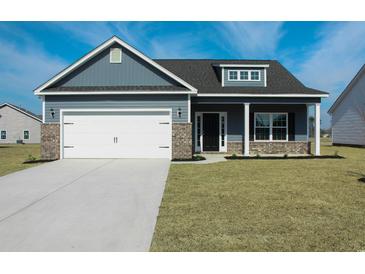 Charming single-Gathering home with a modern design, manicured lawn, attached garage, and inviting curb appeal at 364 Hayloft Circle, Conway, SC 29526