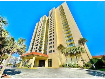 Beautiful oceanfront condo tower featuring striking architecture and palm trees against a clear blue sky at 8560 Queensway Blvd. # 304, Myrtle Beach, SC 29572