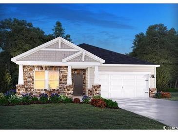 Inviting single-story home with stone accents, gray shake siding, an attached two-car garage, and a well-manicured lawn at 1570 Regal Fern Way, Longs, SC 29568