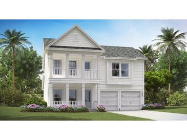 Charming two-story home featuring double front porches, a two-car garage, and lush landscaping at 8743 Baton Rouge Ave Nw, Calabash, NC 28467