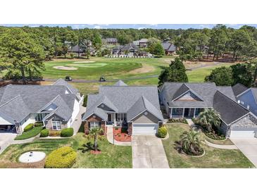Stunning aerial view of a home on a golf course, showcasing the beautiful community and well-maintained landscaping at 136 Regency Dr., Conway, SC 29526